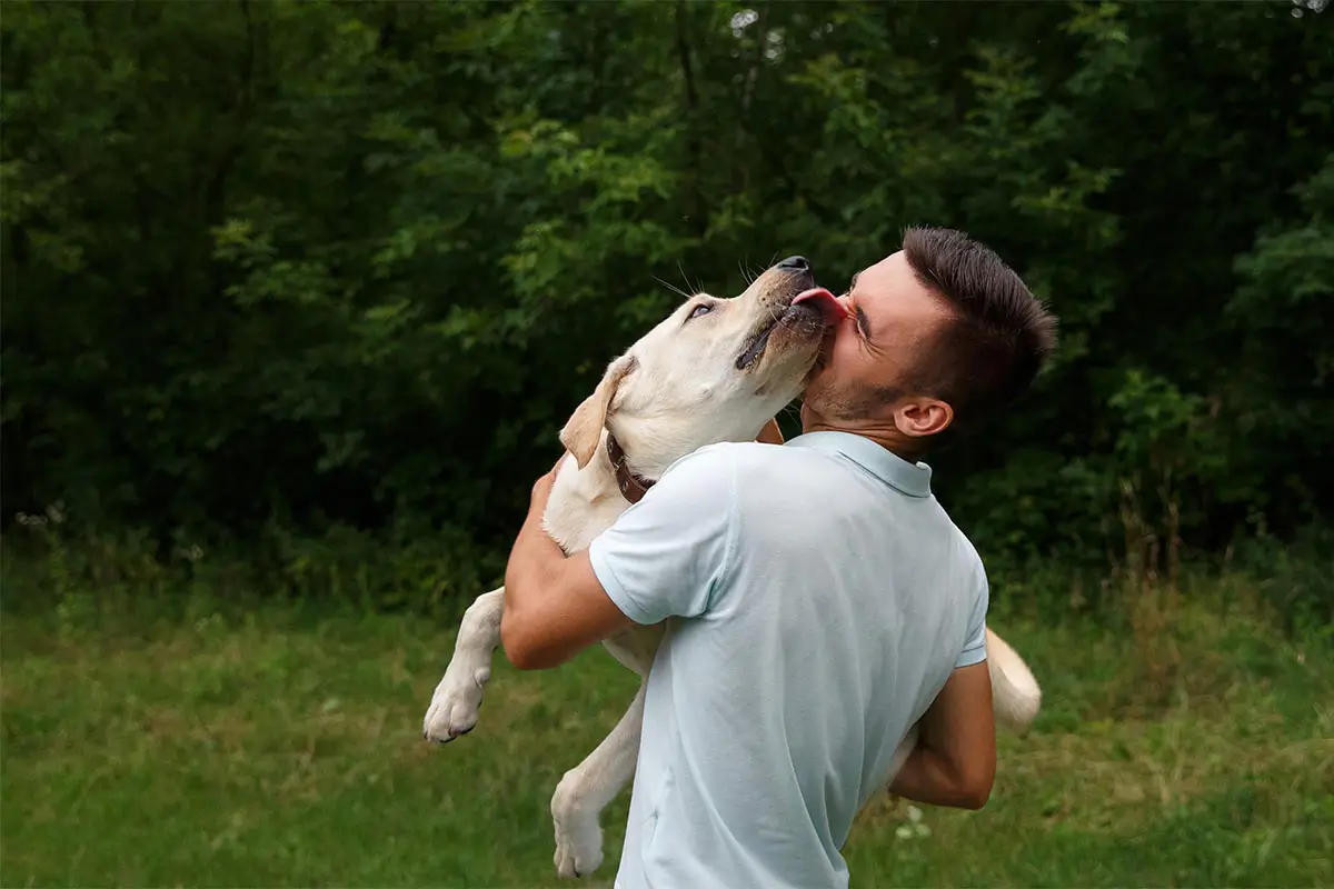 Pets first, people always at Vetopia Animal Health Man holding his dog